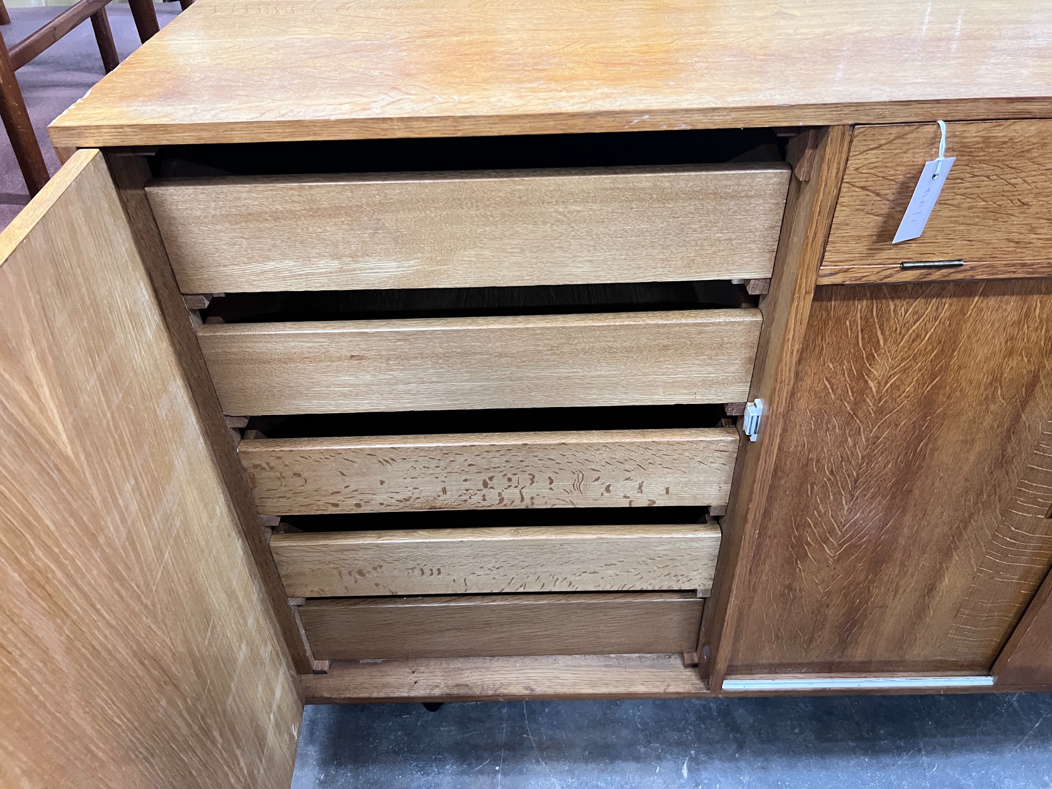 A mid century golden oak sideboard, width 140cm *Please note the sale commences at 9am.